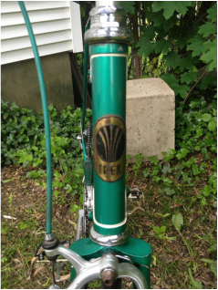 Another angle of the green bicycle. This time it is focused on the tube badge.