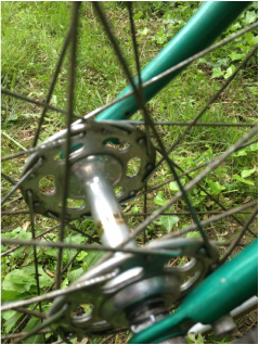 This picture focuses on a different part of the green bicycle.