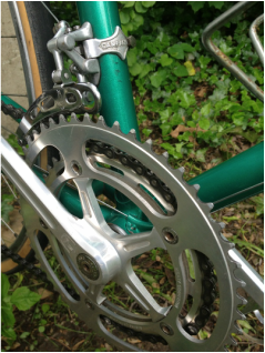 Another closeup of the green bicycle that shows what a work of art it is.