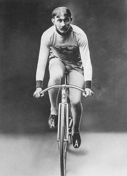 A black-and-white photo of Mile-A-Minute Murphy riding a bike.